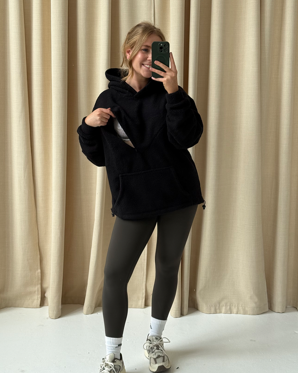 Black oversized nursing fleece hoodie with the discreet nursing zip open