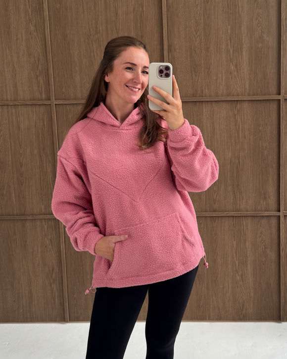 Pink oversized nursing fleece hoodie, front view with hood up
